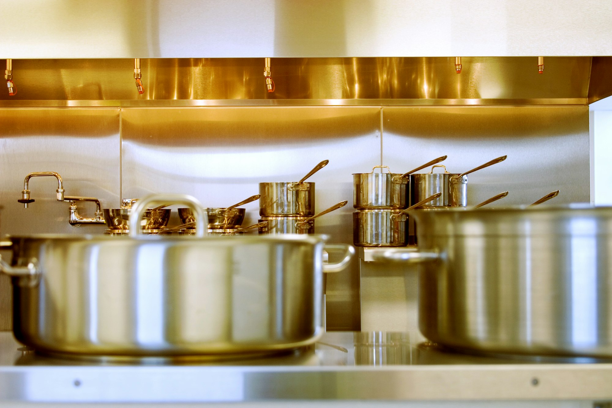 Stainless steel commercial cookware ready for professional kitchens